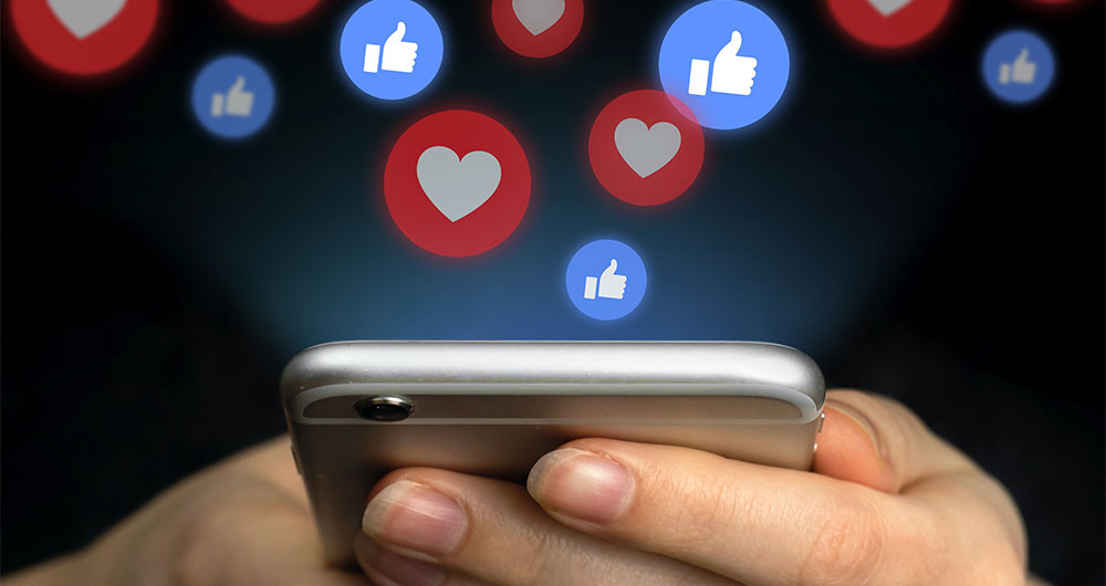mobile with social media interaction icons, such as Instagram.