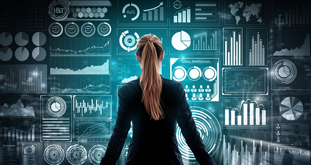 Screen with data and graphics, with a girl in front of it