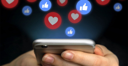 móvil con iconos de interacción en redes sociales, como instagram.