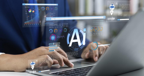 Unas manos tecleando sobre un ordenador dodne se muestras las siglas AI (inteligencia artificial)