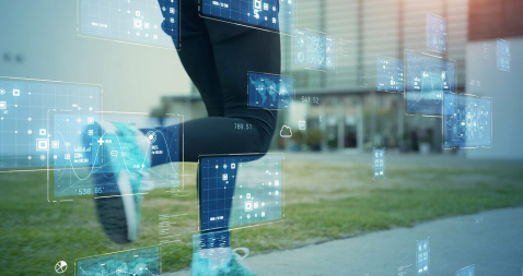 Legs of a running person with data and graphs in the foreground