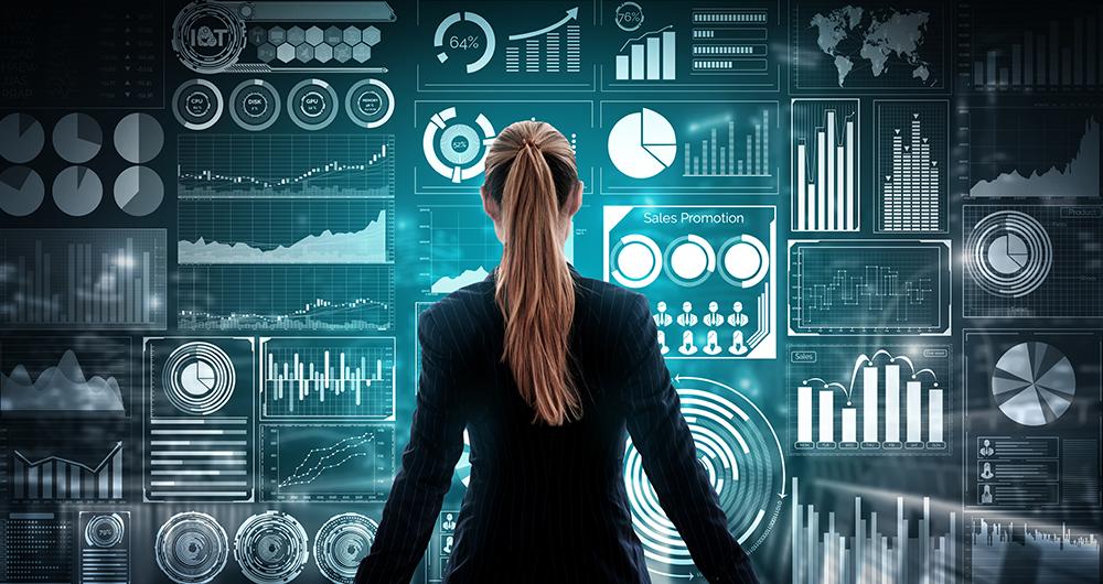 Screen with data and graphics, with a girl in front of it
